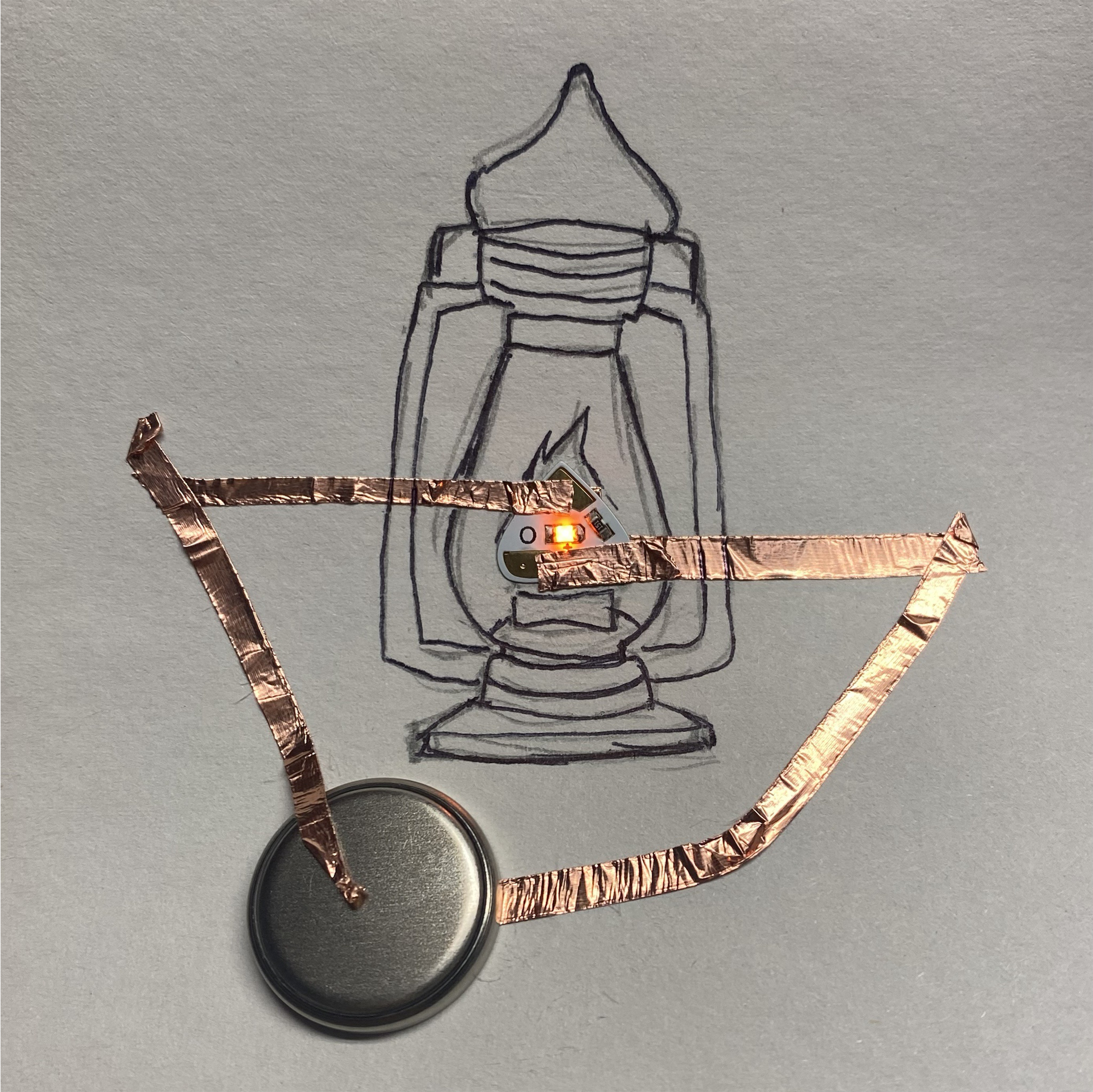 This is a simple circuit where the LED is in the place of fire inside an old lamp. The copper tape is still above the lamp itself here.